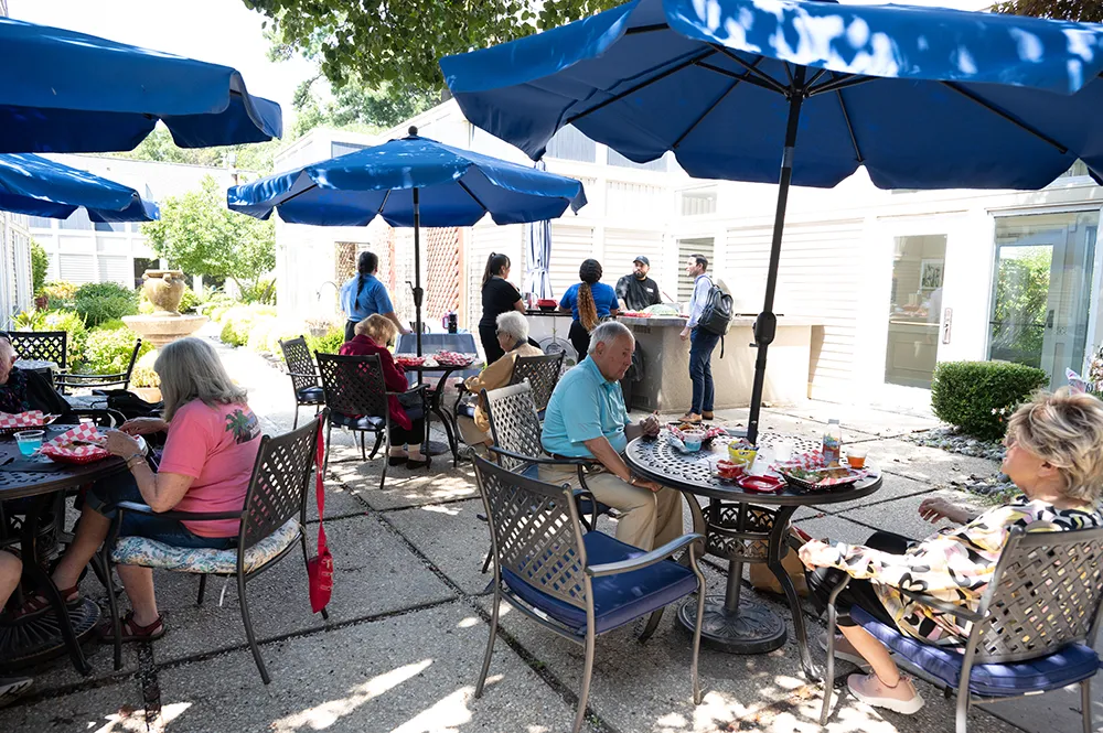 outside al fresco eating area with tables and umbrellas