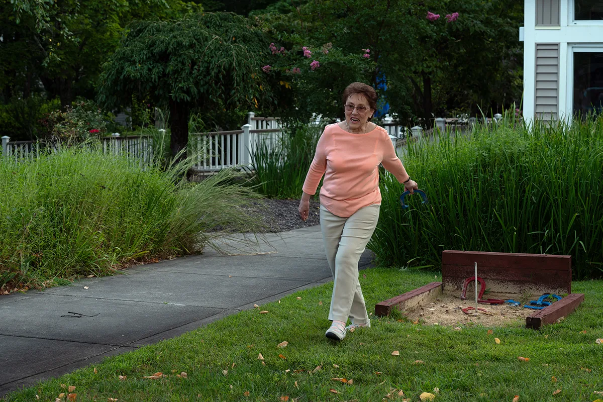 woman playing a game of horseshoes