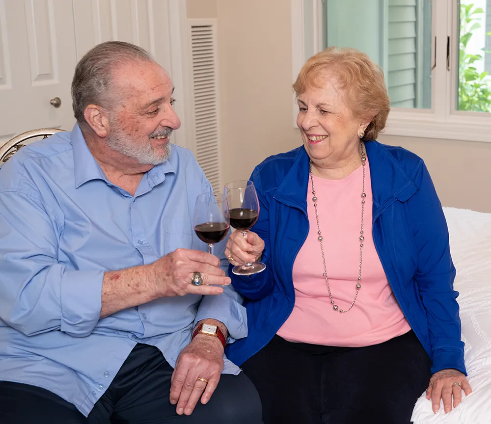 husband and wife enjoying a glass of wine