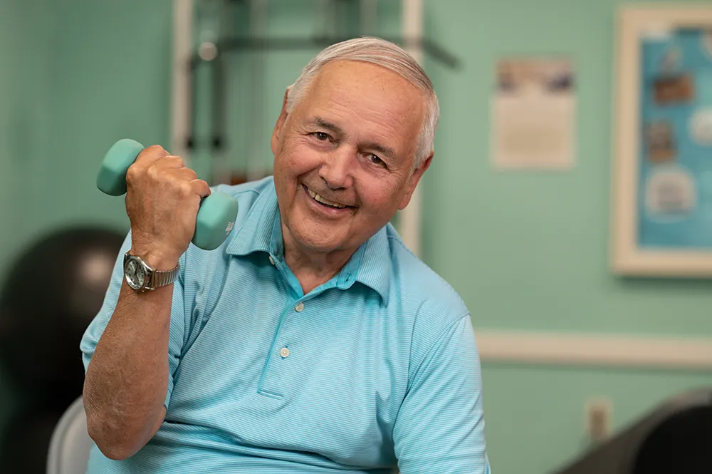 a man doing curls with a dumbbell