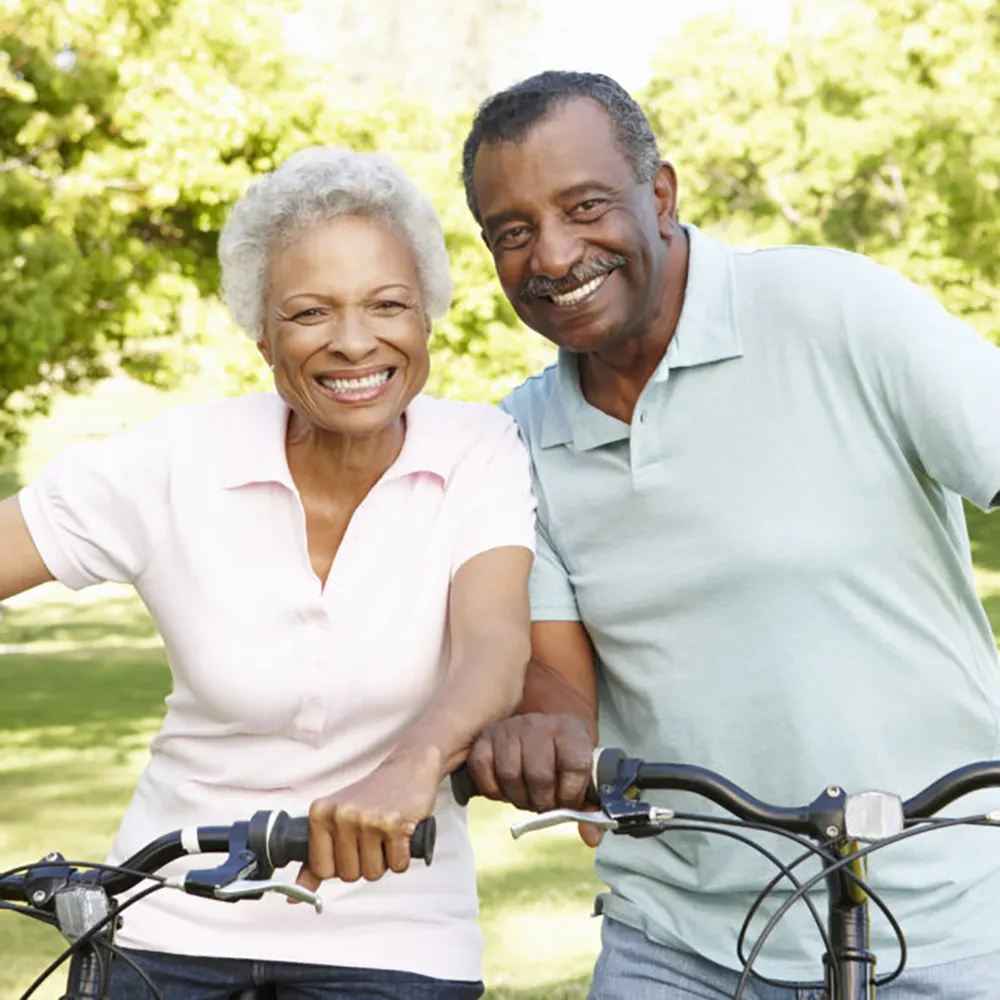 African American couple riding bikes