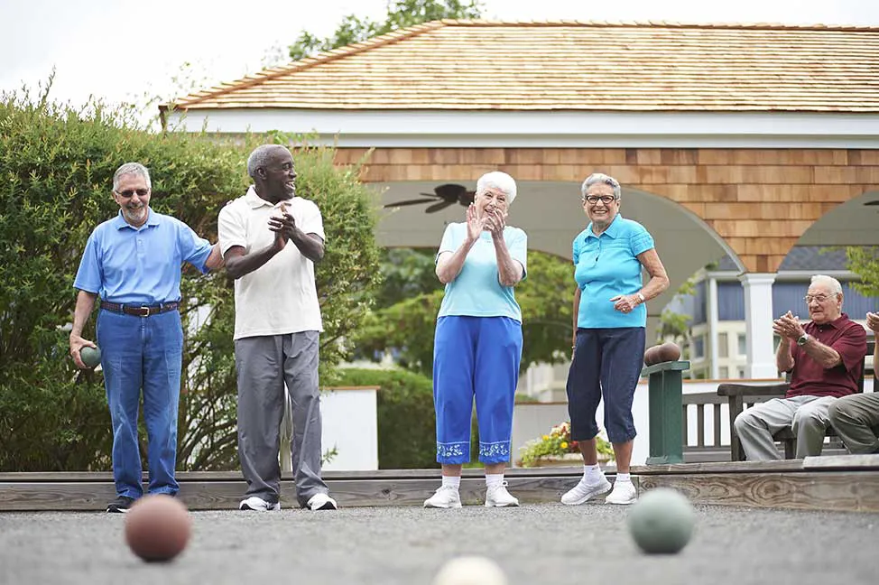 men and women playing bocce