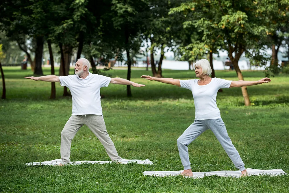 a man and a woman doing yoga